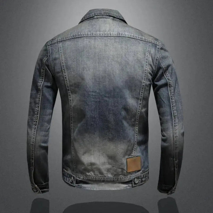 Stylish men's vintage denim jacket, zip-up, washed blue for a retro look, versatile casual outerwear.