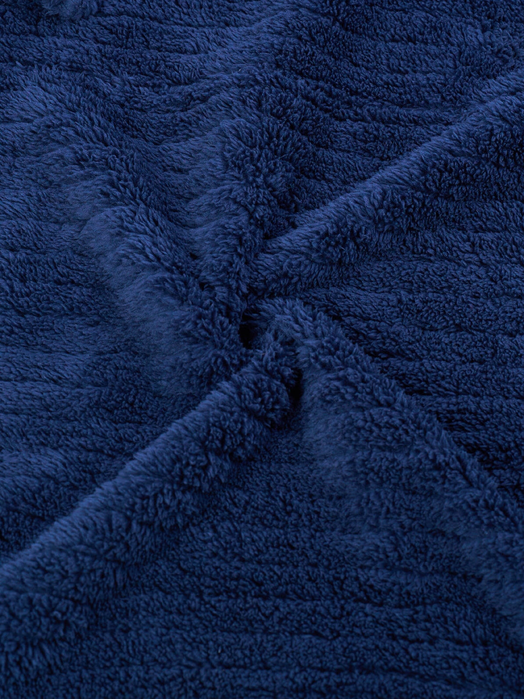 Man wearing a comfortable fit men's winter fleece bathrobe, perfect soft loungewear for chilly mornings.