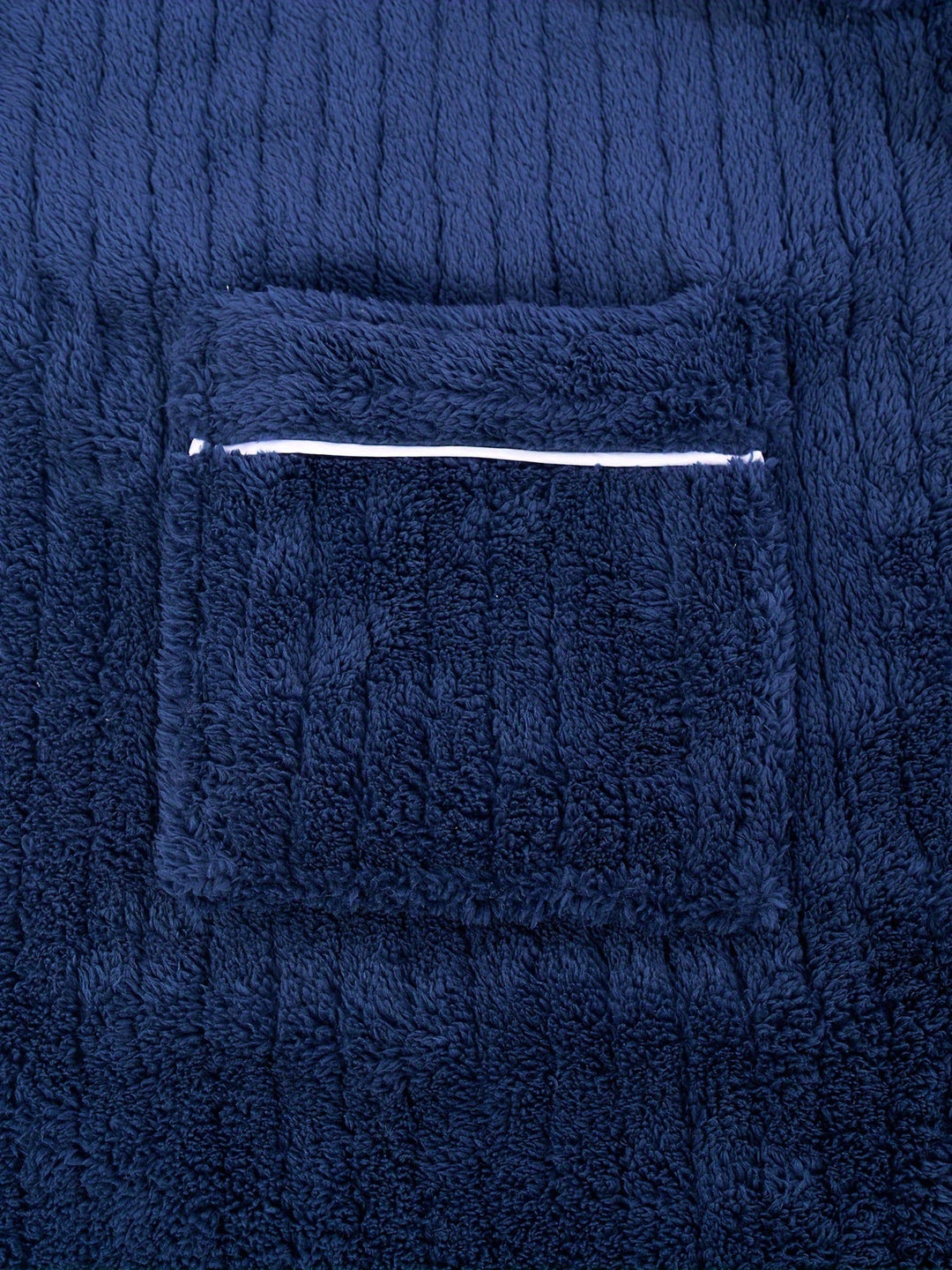 Man enjoying cozy comfort in a soft fleece winter bathrobe, ideal warm sleepwear and loungewear for home.