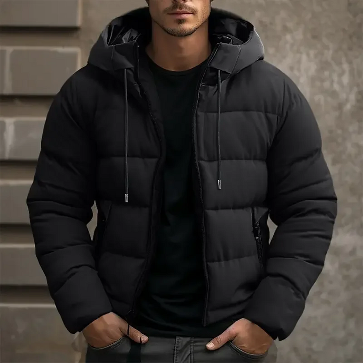 Thick quilted men's puffer winter jacket with a cozy hood. Offering warmth and style for winter.