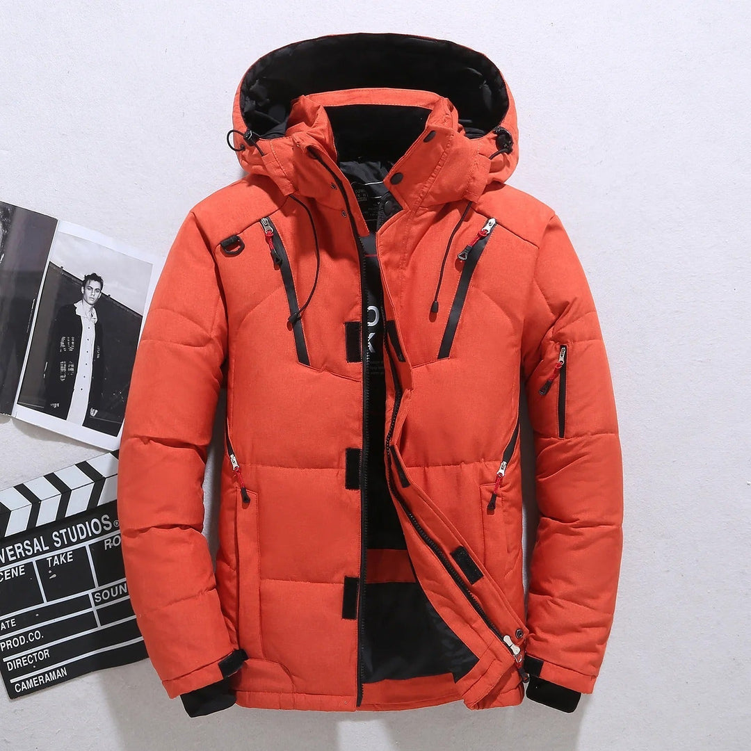 Insulated men's hooded puffer jacket. Warm, lightweight outerwear for cold weather. Essential winter jacket for men.