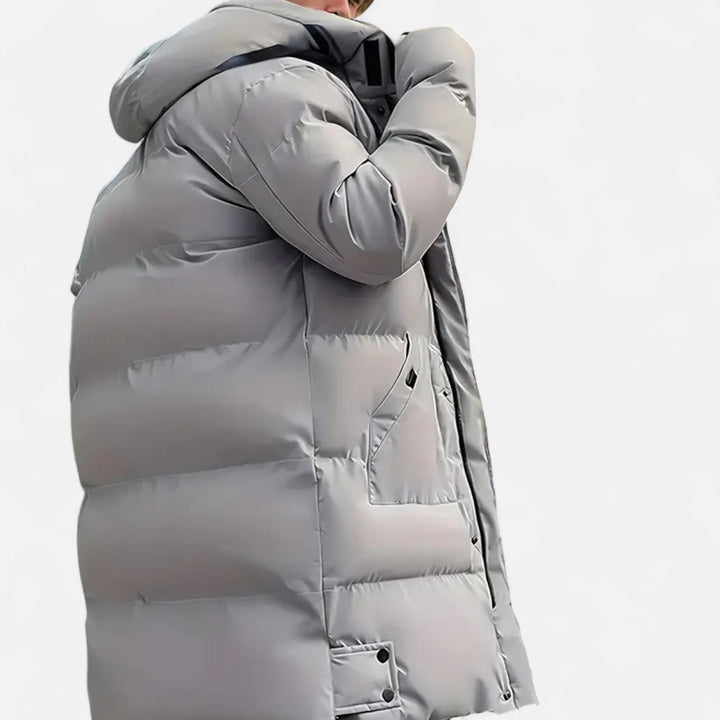 Modern men's stylish hooded winter jacket, delivering exceptional warmth for cold weather comfort.