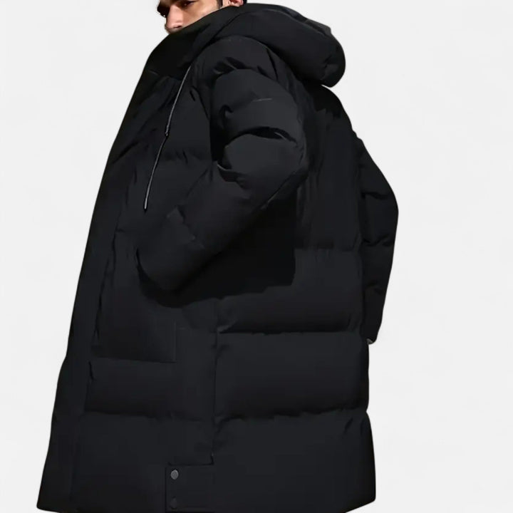 Versatile men's winter jacket, hooded & warm, ideal for casual outfits or rugged outdoor use.