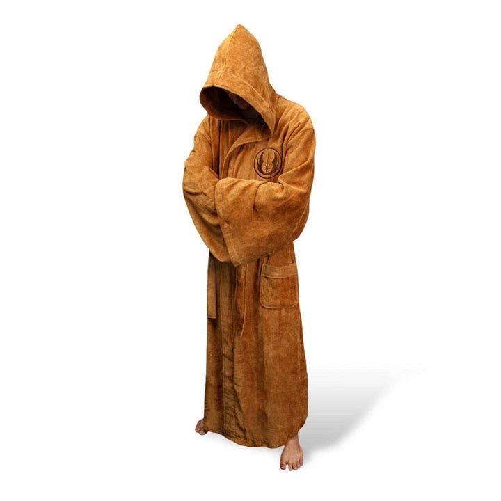 A man relaxing at home in a luxurious, warm, and extra-long bathrobe.