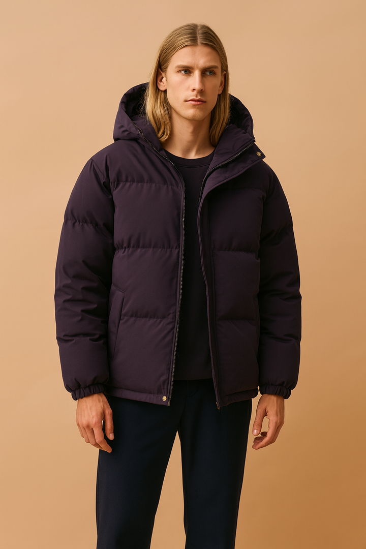 Insulated men's quilted winter jacket with hood, providing warmth and comfort for cold outdoor activities.