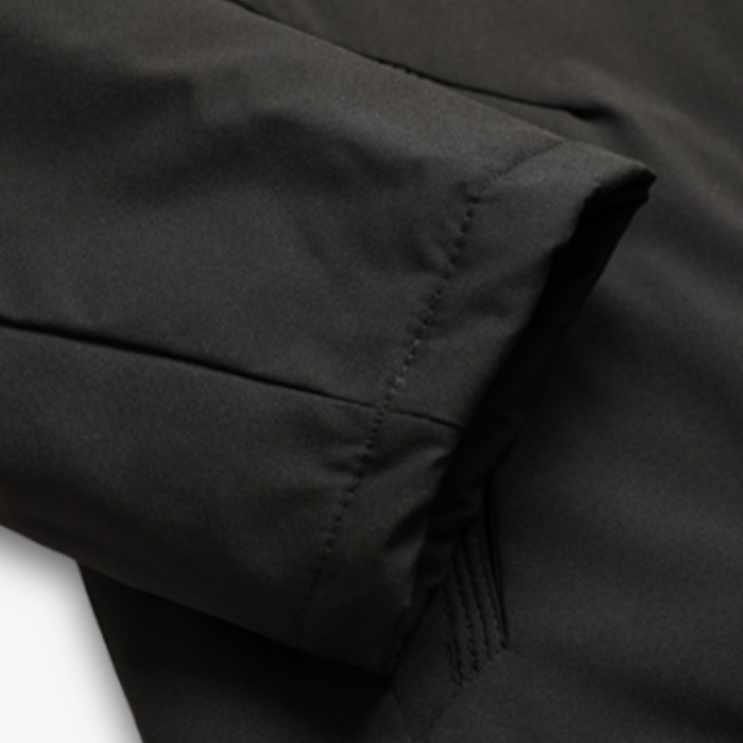 Zippered men's waterproof outerwear with hood, an all-weather solution for men's fashion.