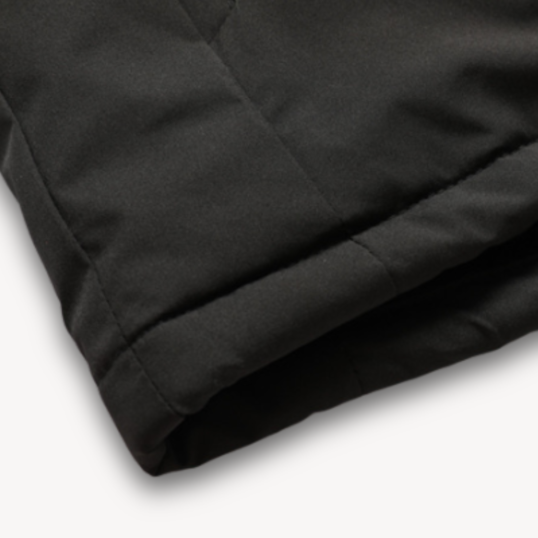 Men's durable rain jacket, hooded and waterproof, combining style with outdoor functionality.