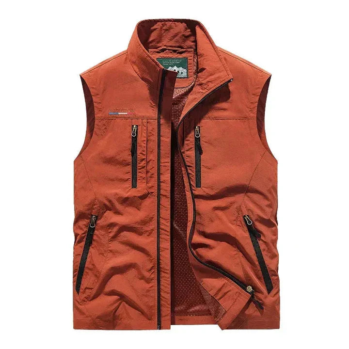 Men's waterproof insulated outdoor vest in black, ideal for all seasons & adventure layering.