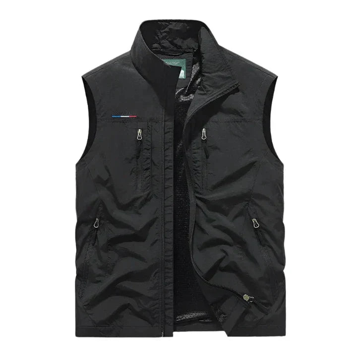Rugged men's insulated vest with zipper pockets, an all-season outdoor gilet for active wear.