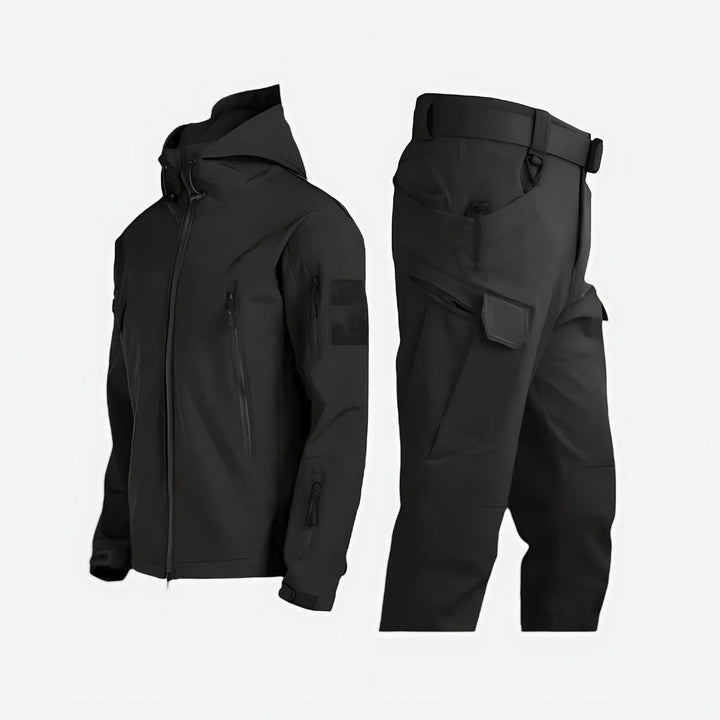 Men's waterproof thermal insulated jacket and trousers set for outdoor winter hiking and mountaineering adventures.