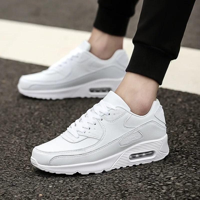 Men's white cushioned sole trainers for everyday street style. Comfortable and versatile lace-up sneakers.