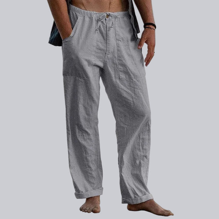 Men's wide leg summer trousers, showcasing a relaxed fit & elegant style. Ideal for modern man's comfort.