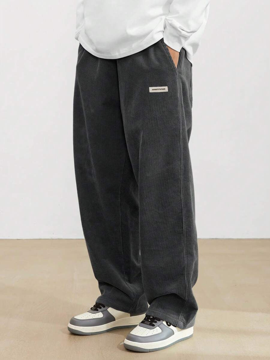 Man wearing comfortable men's wide leg trousers, showcasing a relaxed fit and effortless style for casual everyday fashion.