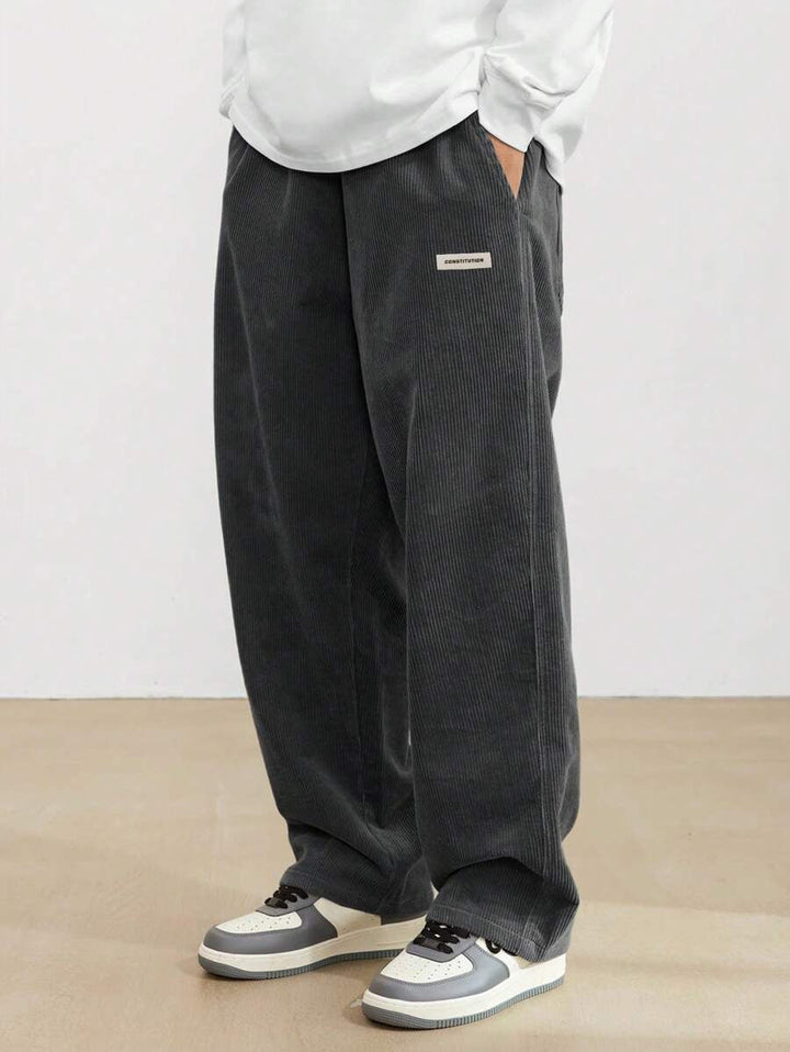 Man wearing comfortable men's wide leg trousers, showcasing a relaxed fit and effortless style for casual everyday fashion.