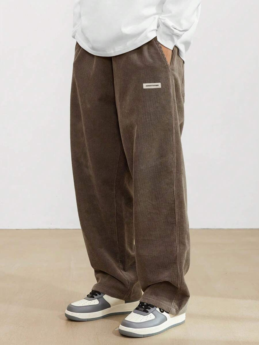 Modern men's wide leg trousers, offering a relaxed fit and comfortable, effortless style. Versatile casual fashion bottoms.