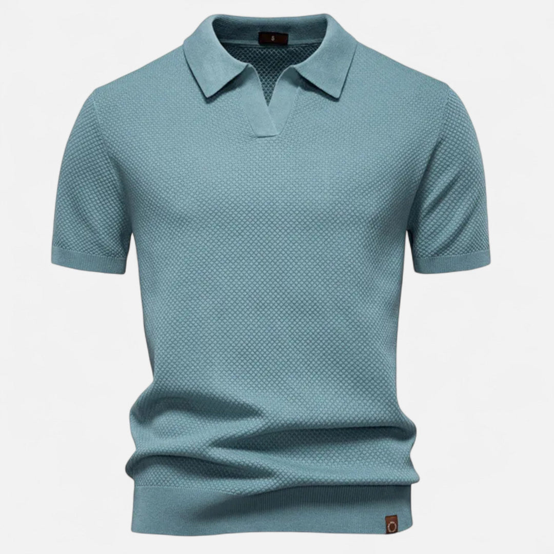 A versatile men's wool polo shirt featuring a playful yet refined pineapple print.