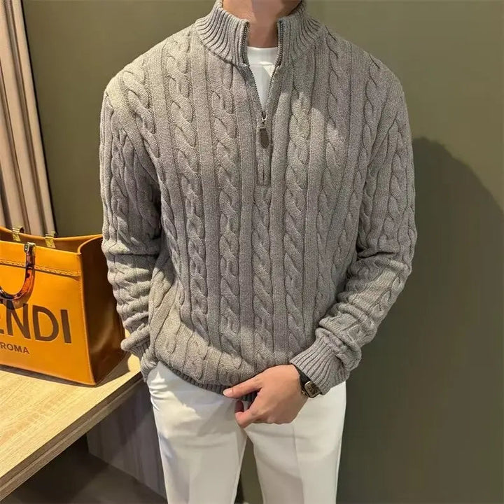 Neatly folded men's cable knit full-zip sweater, ready for fall & winter stylish warmth.
