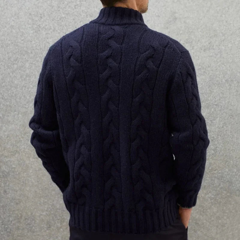 Close-up of men's cable knit full-zip sweater, highlighting the textured knit and durable zipper.