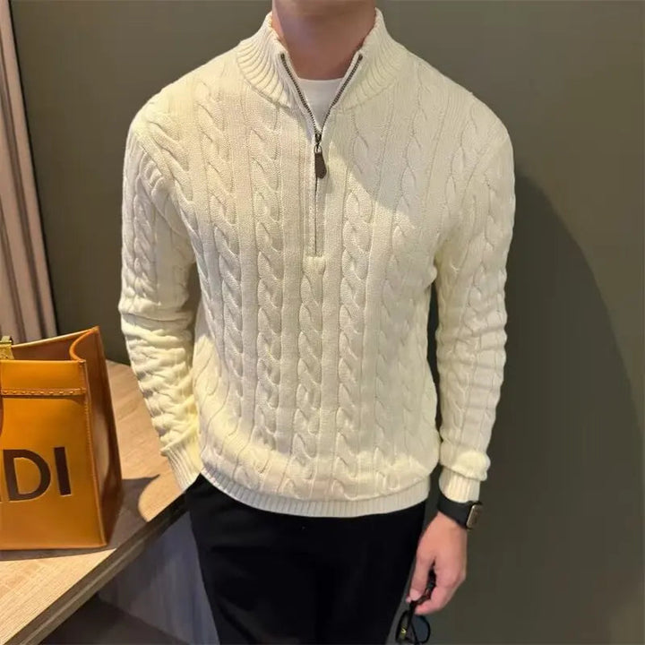 Man wearing a stylish men's zip-up cable knit sweater, showcasing a comfortable and warm fit.