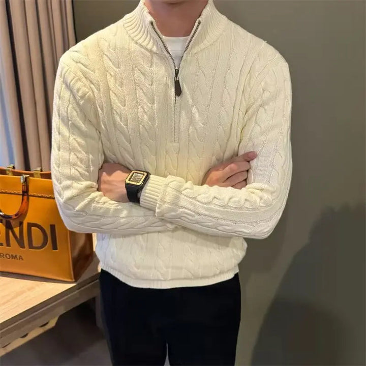 Detailed view of a men's heavy gauge cable knit sweater with a smooth full-zip front closure.