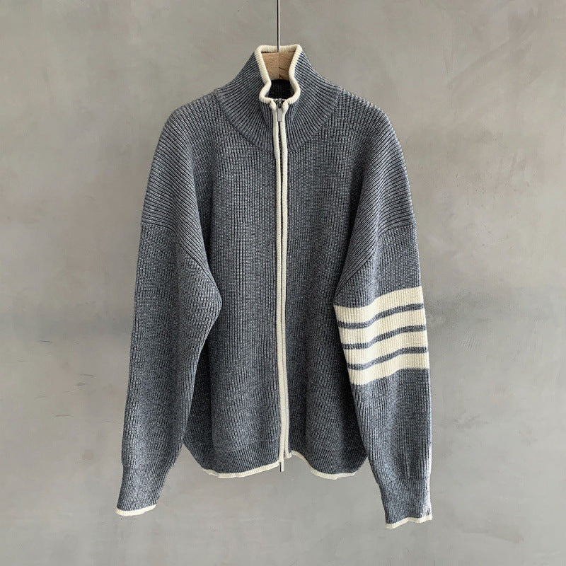 Stylish men's zip-up sweater with unique striped sleeves, a modern outerwear piece for men.