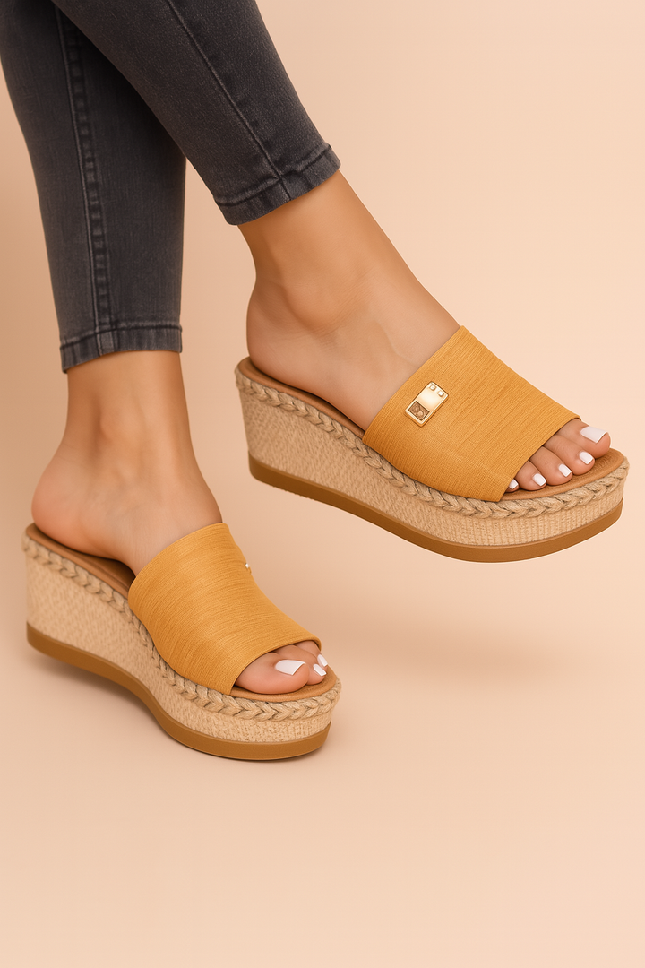 Close-up of Millie tan woven wedge sandals for women, showcasing intricate design.