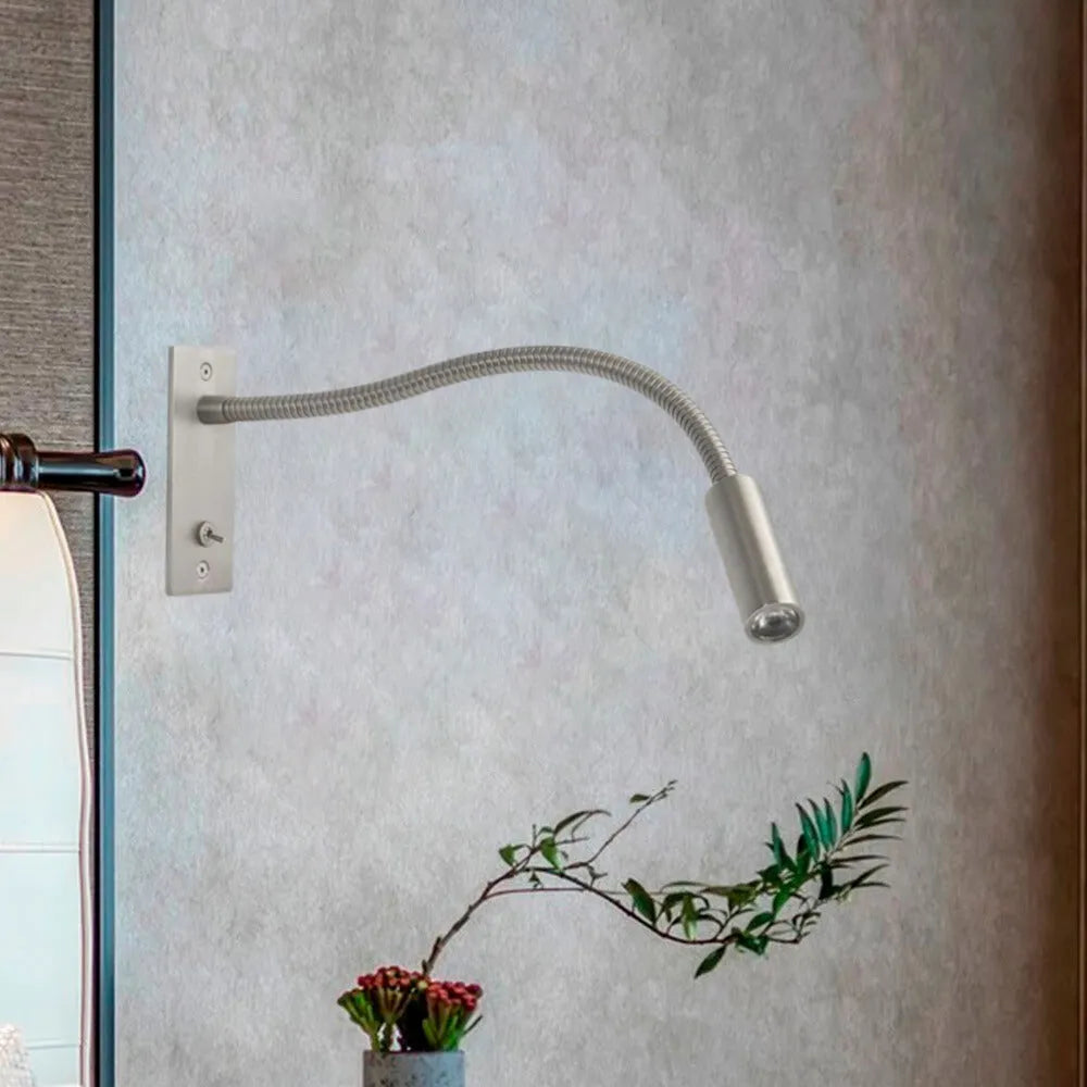 Indoor LED wall lamp featuring an adjustable spotlight for targeted, modern reading light.
