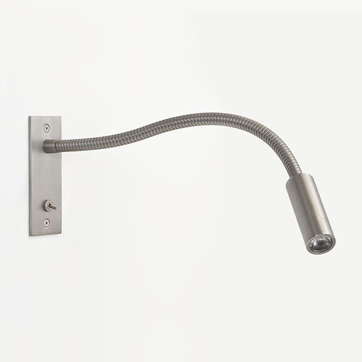 Sleek minimalist metal wall lamp with adjustable LED spotlight, perfect for bedroom reading.