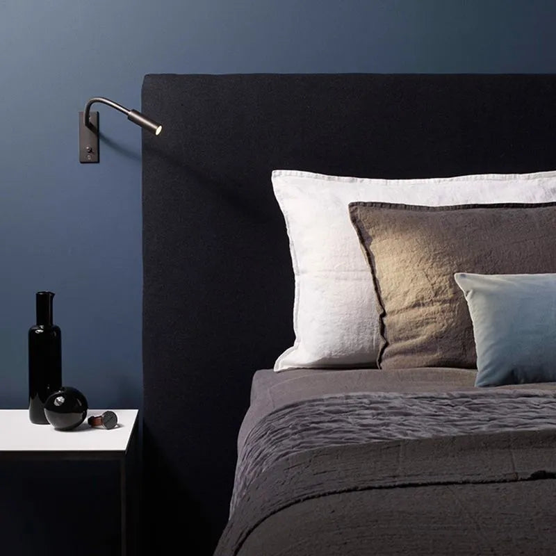 Metal minimalist wall lamp, adjustable LED spotlight, for stylish and functional indoor lighting.