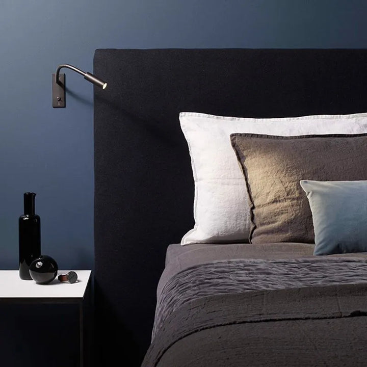 Metal minimalist wall lamp, adjustable LED spotlight, for stylish and functional indoor lighting.