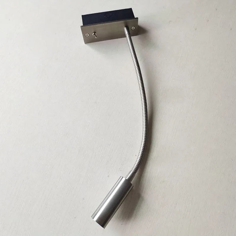 Modern LED wall lamp, adjustable spotlight, versatile indoor lighting for any room.