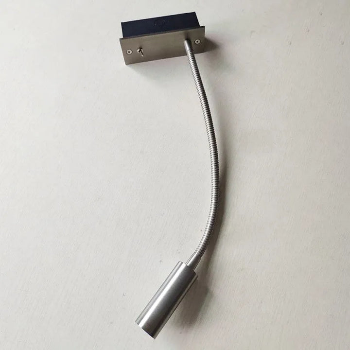 Modern LED wall lamp, adjustable spotlight, versatile indoor lighting for any room.