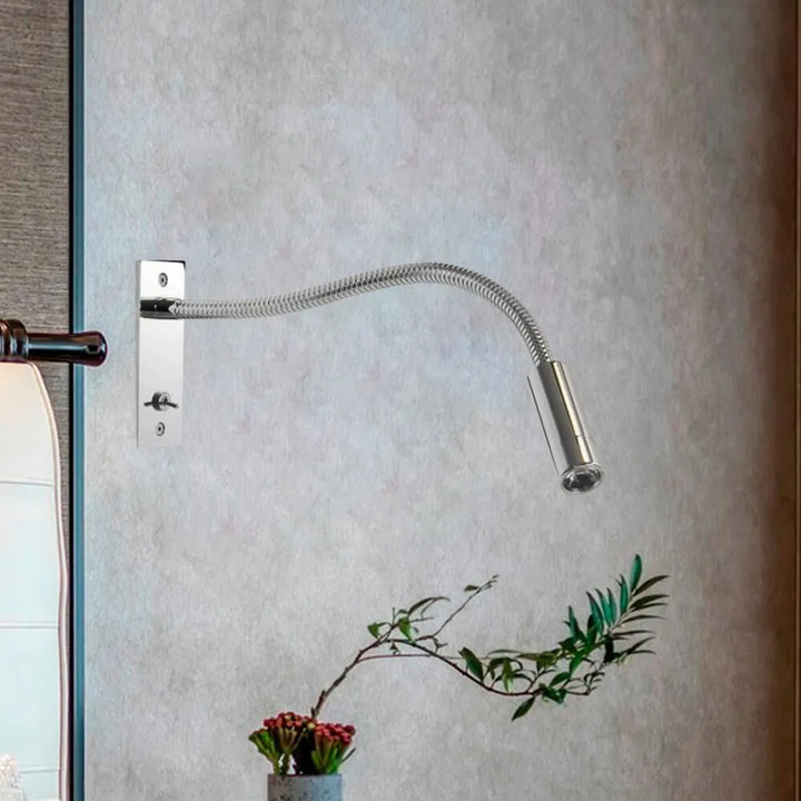 Elegant minimalist wall lamp, adjustable LED spotlight, perfect modern bedroom reading light.