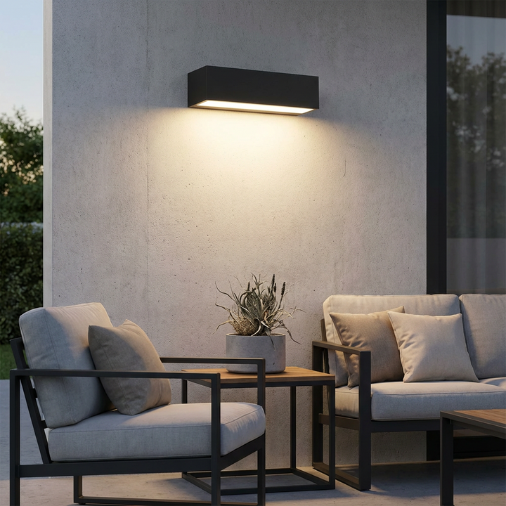 Modern black solar LED wall light, IP65 rated, ideal for exterior garden and patio lighting.