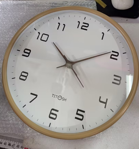 Simple wooden wall clock, minimalist design. Silent & modern for home decor, perfect for living rooms.