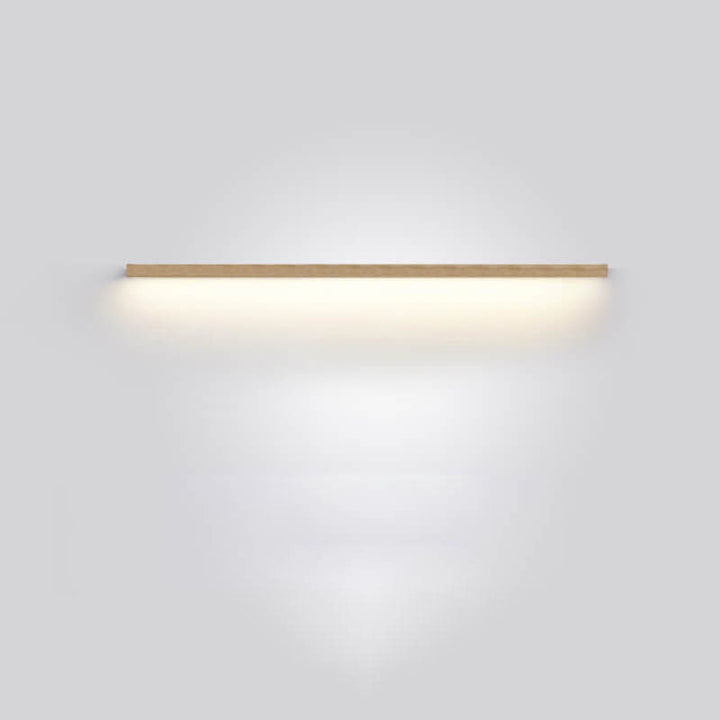Minimalist wooden wall lamp casting warm ambient light