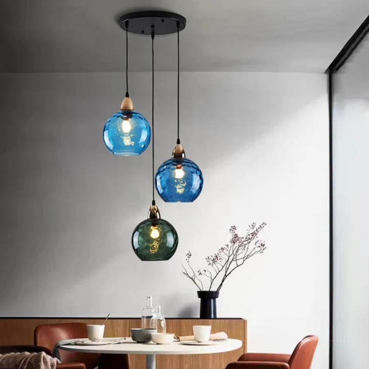 Elegant three-light cluster pendant lamp, a modern decorative ceiling fixture for homes.