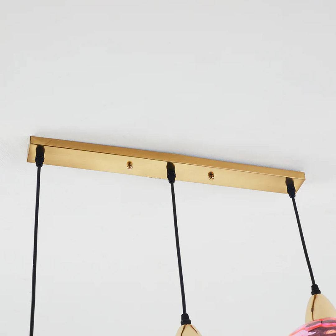 Adjustable LED cluster pendant lamp with three lights, ideal modern lighting for living rooms.