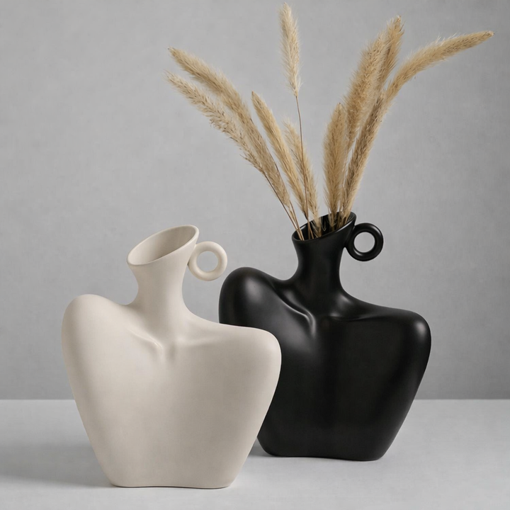 Modern abstract ceramic vase, perfect for minimalist home decor. Elegant table accent or decorative sculpture.