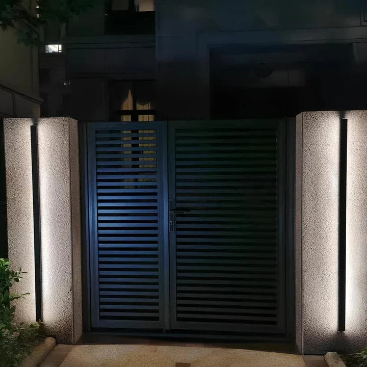 Modern backlit outdoor wall sconce light for contemporary home exterior.