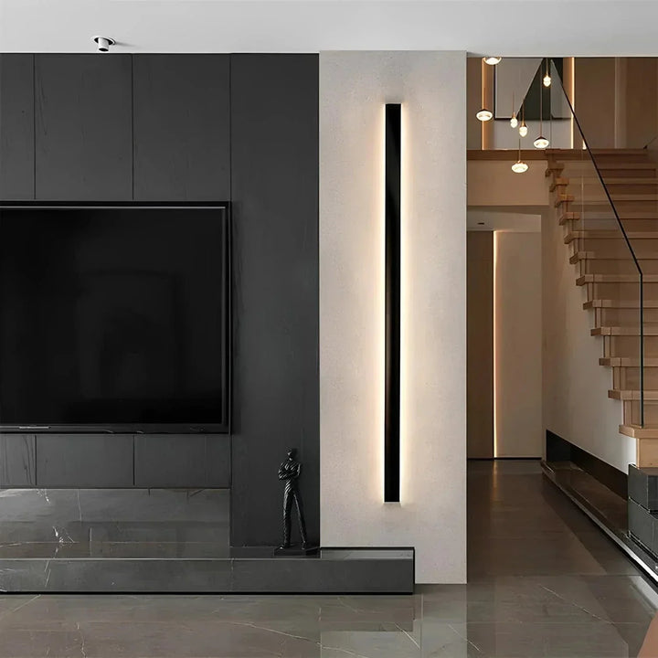 Backlit modern outdoor wall light enhancing the ambiance of a patio at night.