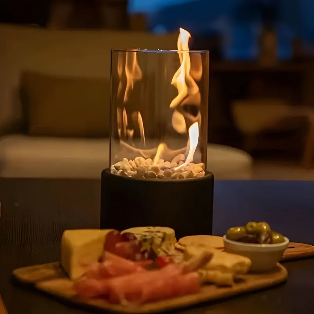 Stylish indoor bioethanol table fireplace. Modern design with glass & metal base for home decor.