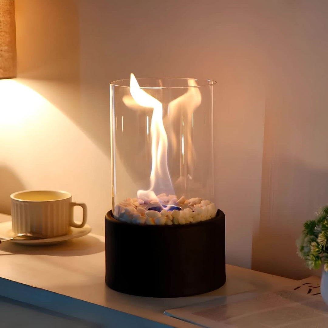 Black modern bioethanol table fireplace with glass; creates clean, smokeless indoor/outdoor ambiance.