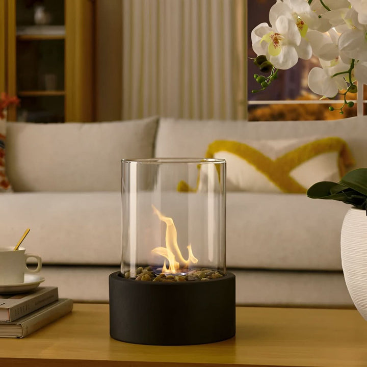 Versatile bioethanol table fireplace for indoor/outdoor ambiance. Modern, portable, smokeless flame.