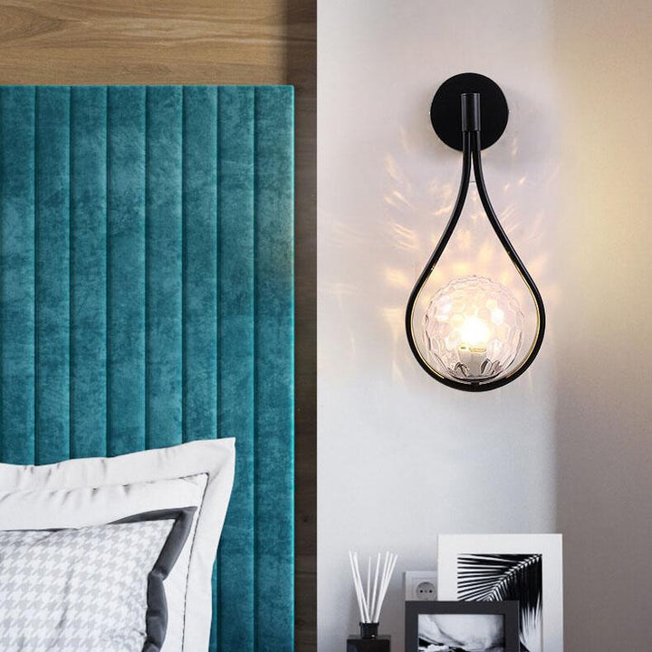 Decorative LED globe lamp, ideal as a modern bedroom wall light.