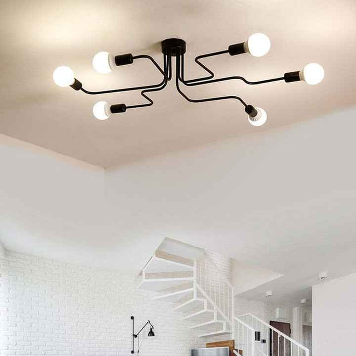 Sleek black flush mount ceiling light, ideal for modern bedroom or living room lighting.