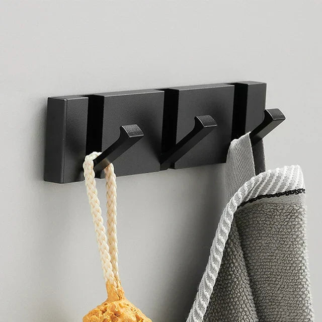 Kitchen organizer wall hook, modern black & gold, foldable design for tidy and efficient storage.