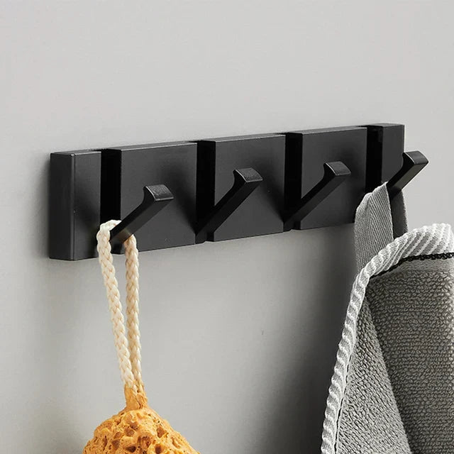 Decorative foldable wall hook, black & gold. Enhances modern decor while offering smart organization.
