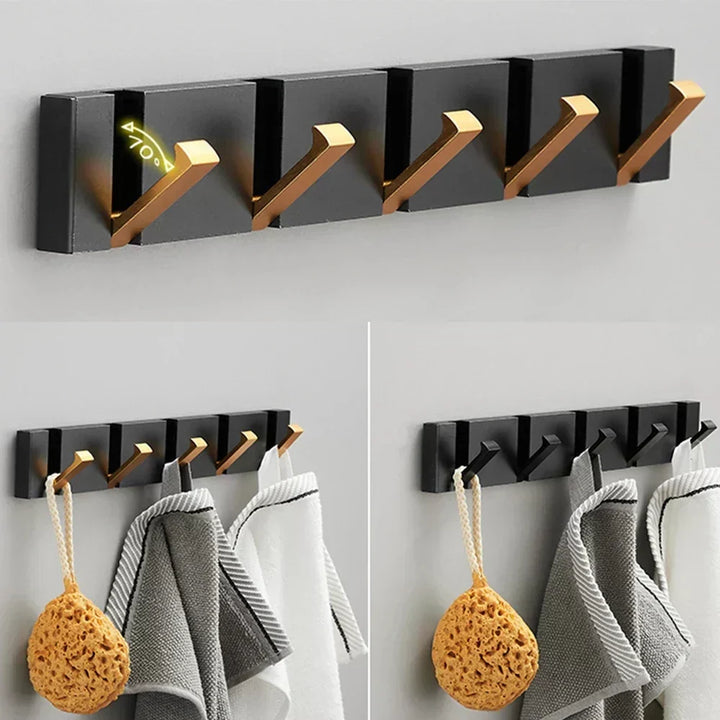 Elegant black & gold foldable wall hook for modern home decor and entryway organization.