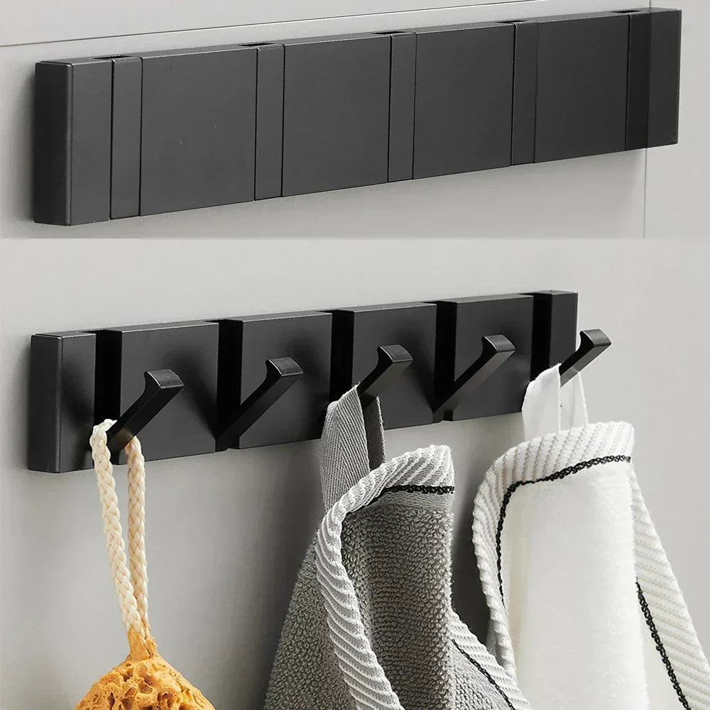 Contemporary foldable coat hook, black & gold finish, ideal for space-saving home organization.